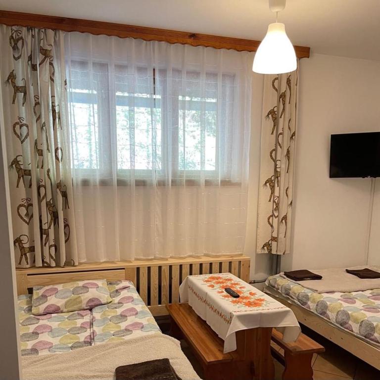 Postel nebo postele na pokoji v ubytování Siedlisko u Jana