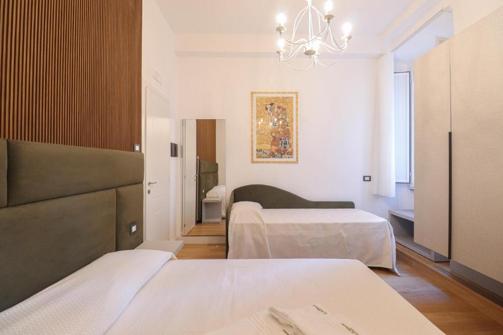Postel nebo postele na pokoji v ubytování Re Di Rhome Guest House