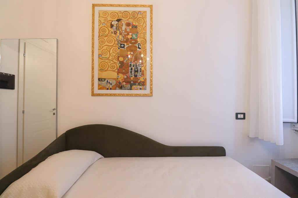 Postel nebo postele na pokoji v ubytování Re Di Rhome Guest House