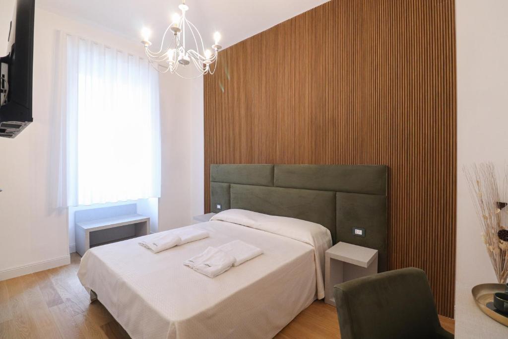 Postel nebo postele na pokoji v ubytování Re Di Rhome Guest House
