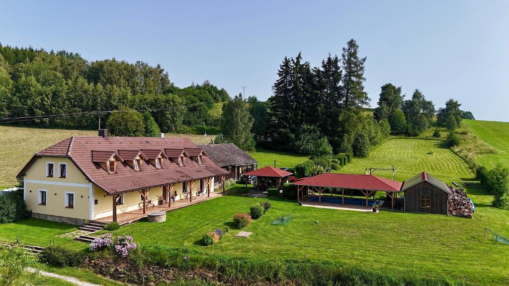 an aerial view of a house on a green hill at Holiday home Hůrka in Hurka