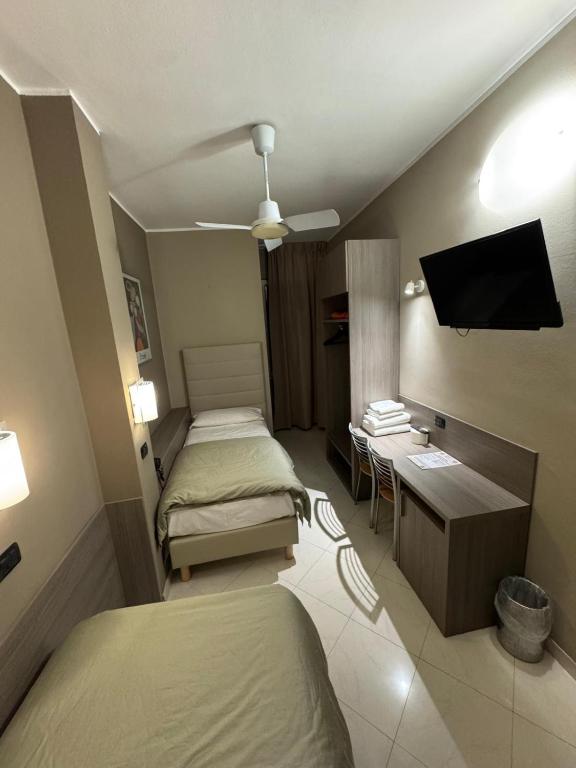 Postel nebo postele na pokoji v ubytování Hotel Parma