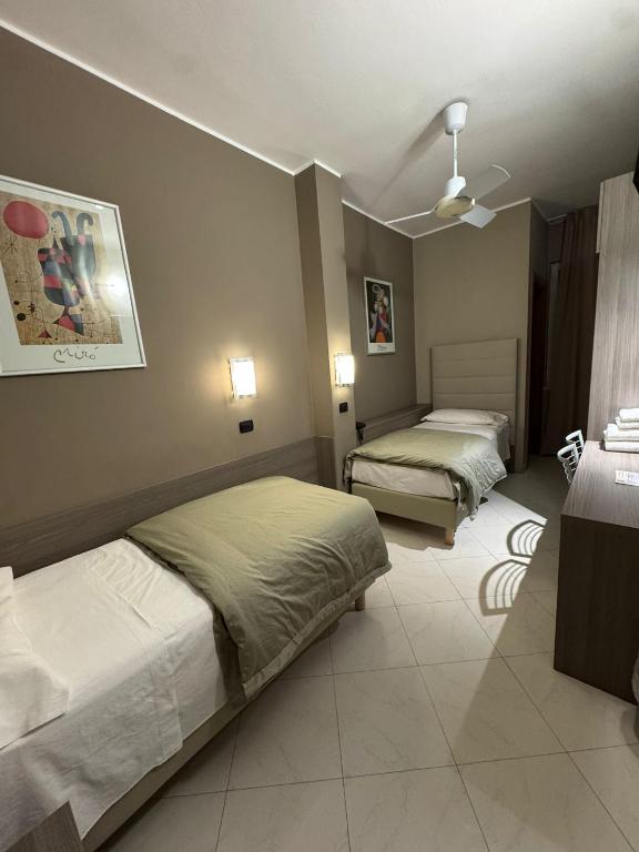 Postel nebo postele na pokoji v ubytování Hotel Parma