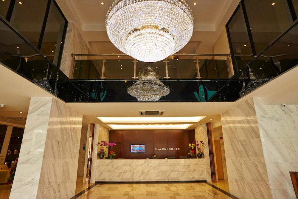 a large chandelier in a building with a lobby at City Comfort Hotel Kuala Lumpur City Center (Bukit Bintang) in Kuala Lumpur