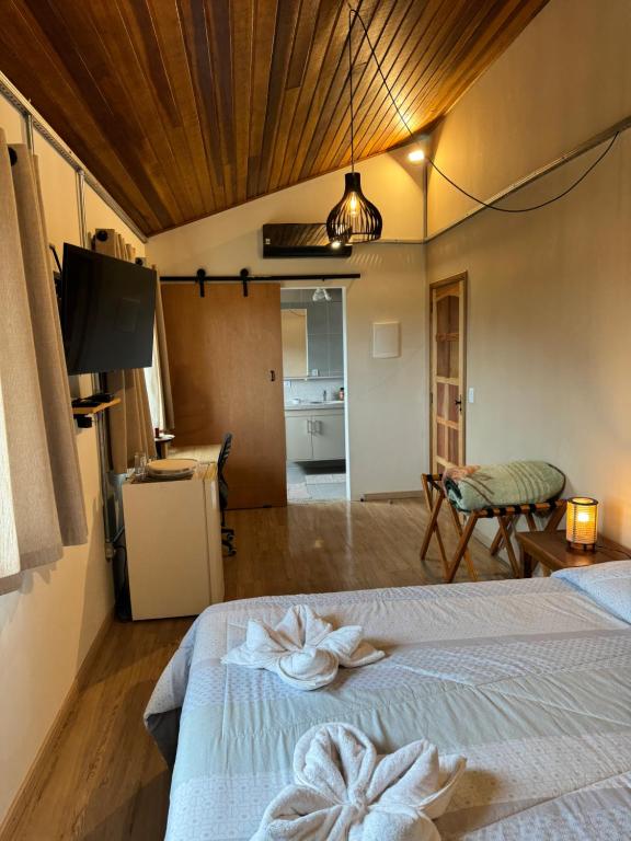Katil atau katil-katil dalam bilik di Hospedaria dos Alpes