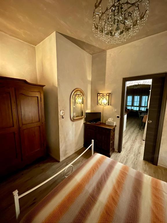 A bed or beds in a room at La maison nel cuore di Genova free parking