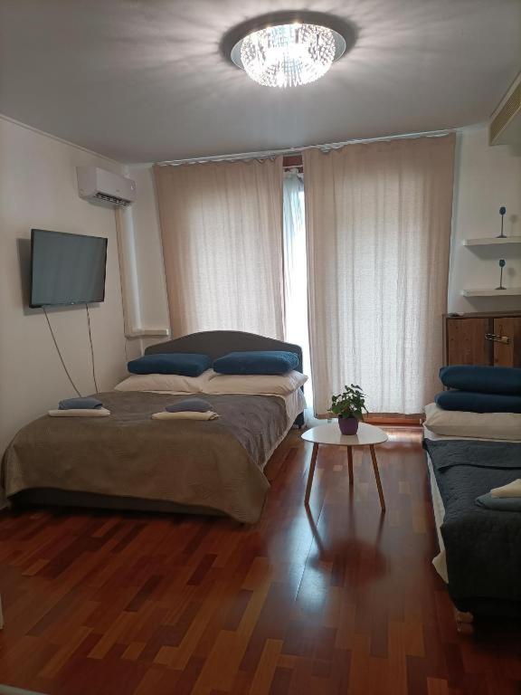 Posteľ alebo postele v izbe v ubytovaní Cleopatra Apartment Budapest