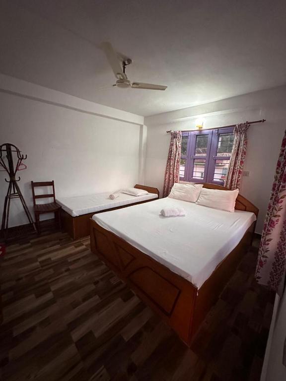 Letto o letti in una camera di Hotel Harmony