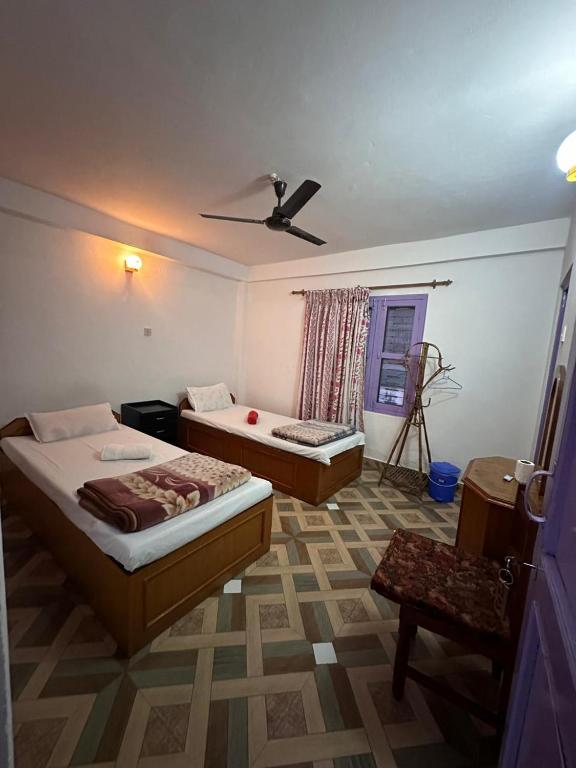 Letto o letti in una camera di Hotel Harmony