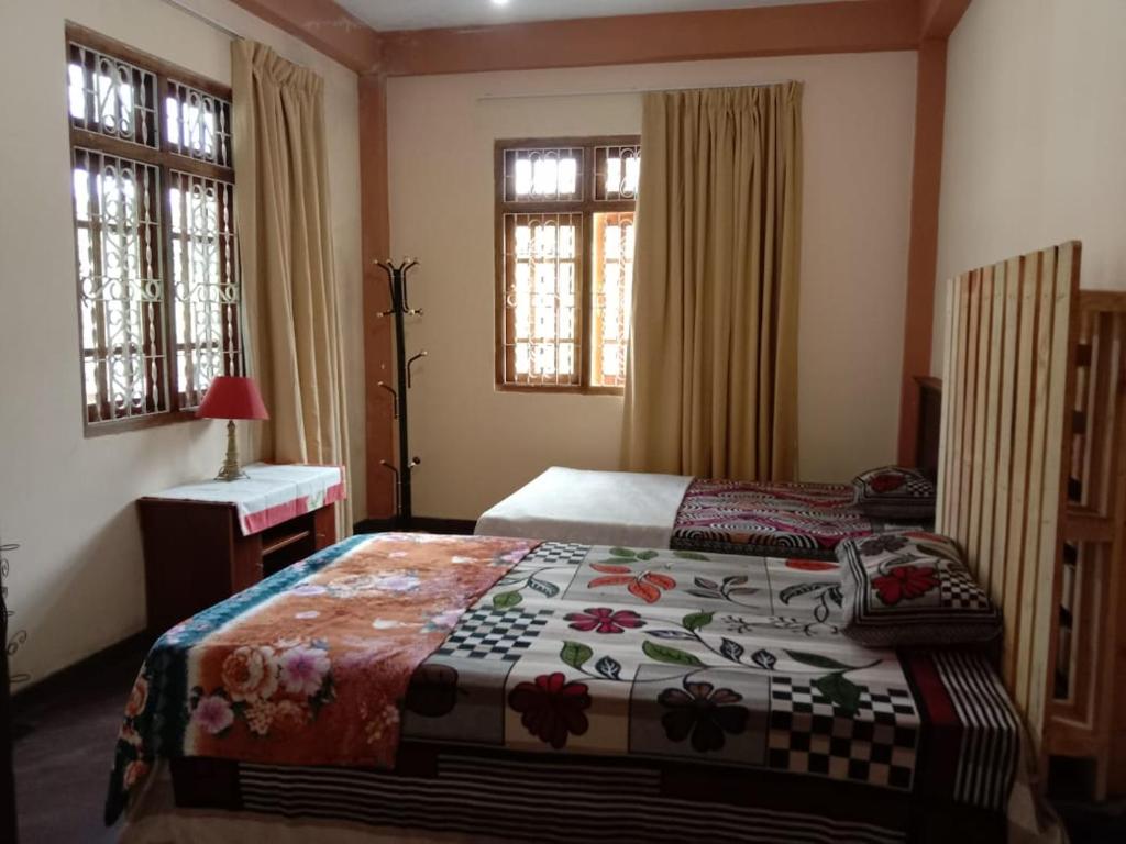 Postel nebo postele na pokoji v ubytování Shane HomeStay