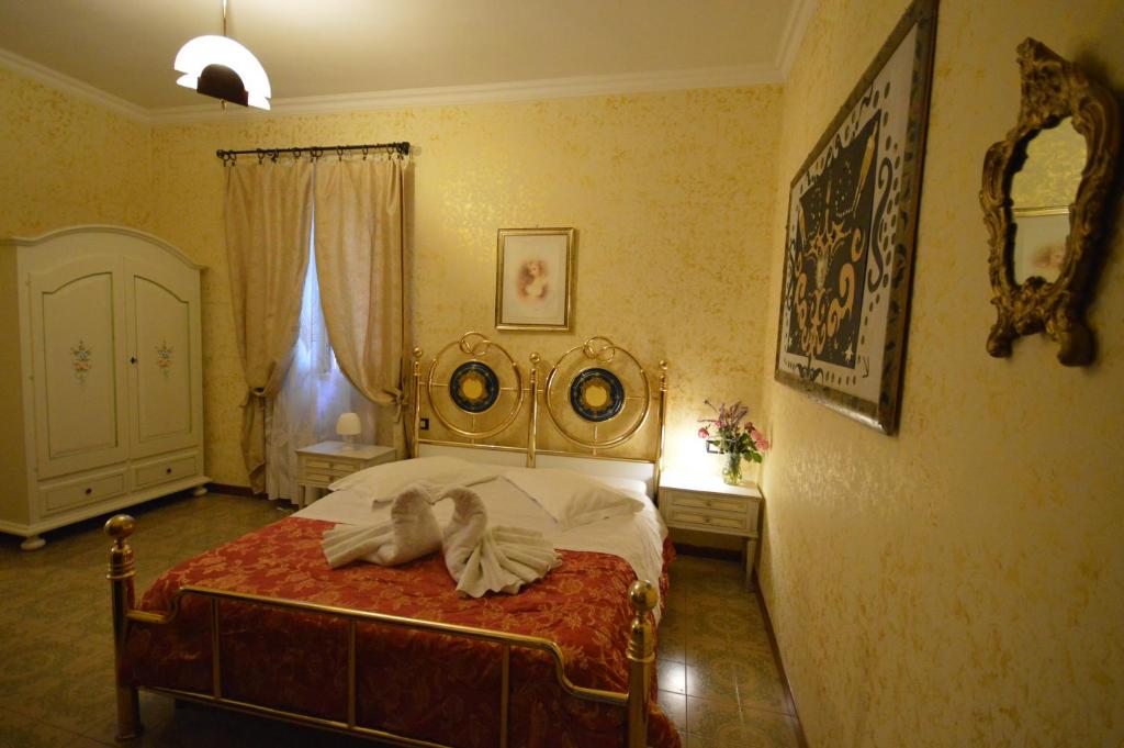 Postel nebo postele na pokoji v ubytování Hotel Alexis