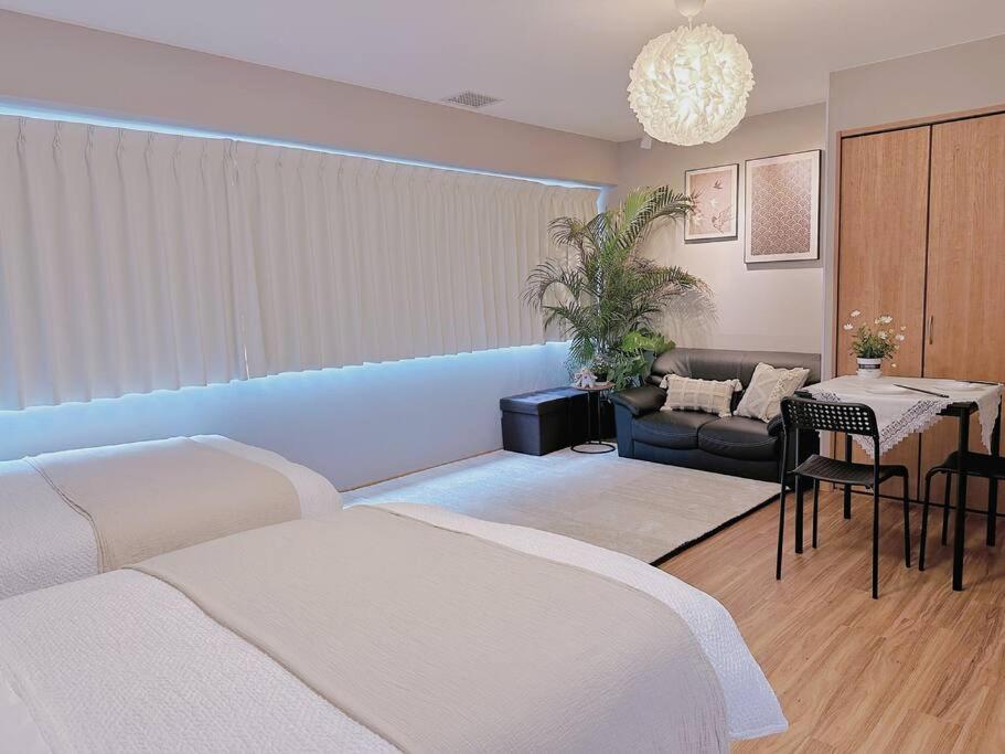 Postel nebo postele na pokoji v ubytování 55平方!2卧室可住7人,5分黒門市場,難波,道頓堀,心斎橋,大阪城,天王寺,Wi-Fi,新規