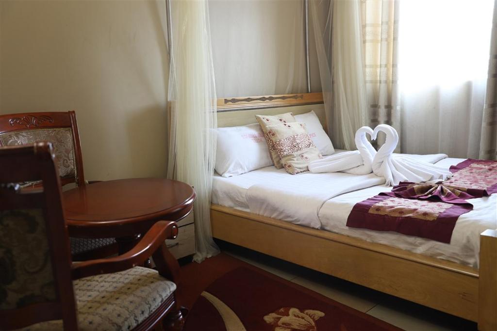 Postel nebo postele na pokoji v ubytování Hotel Intertropics
