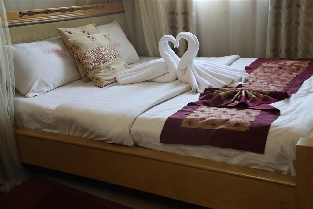 Postel nebo postele na pokoji v ubytování Hotel Intertropics