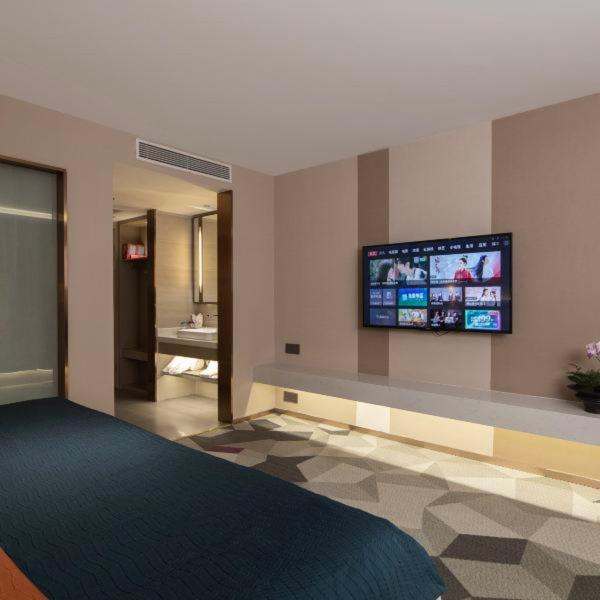 TV a/nebo společenská místnost v ubytování Shenzhen Jincheng Hotel