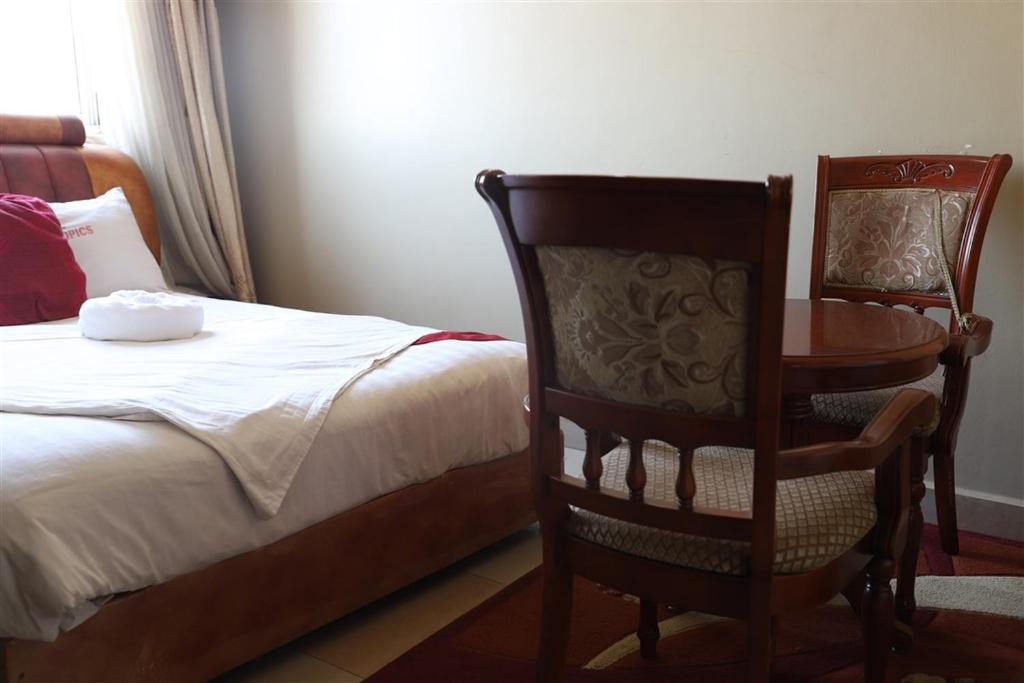 Postel nebo postele na pokoji v ubytování Hotel Intertropics
