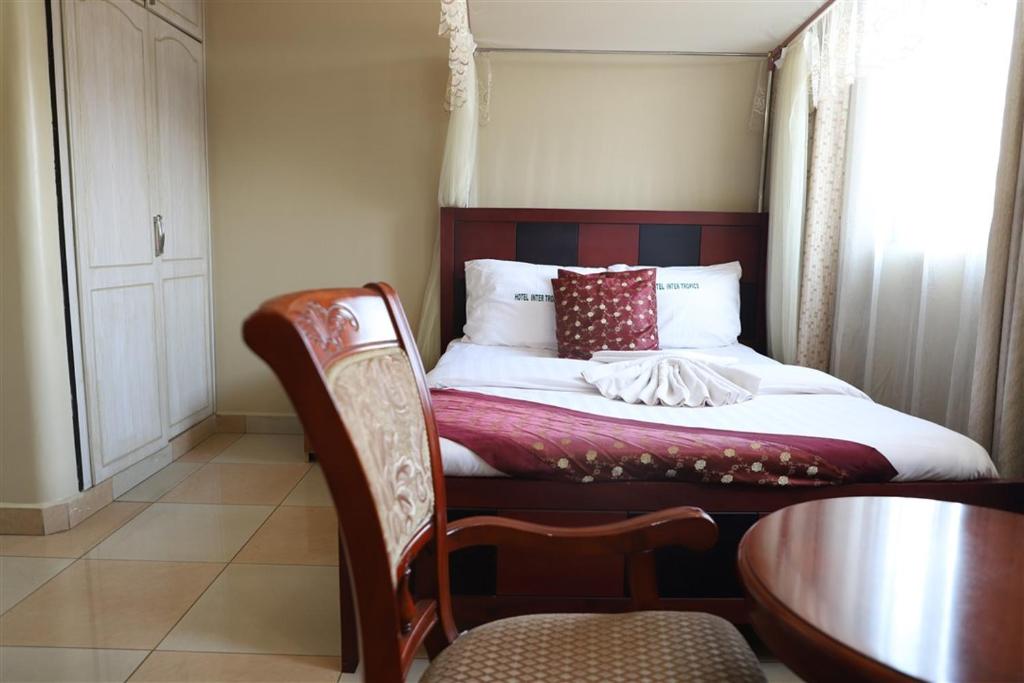 Postel nebo postele na pokoji v ubytování Hotel Intertropics