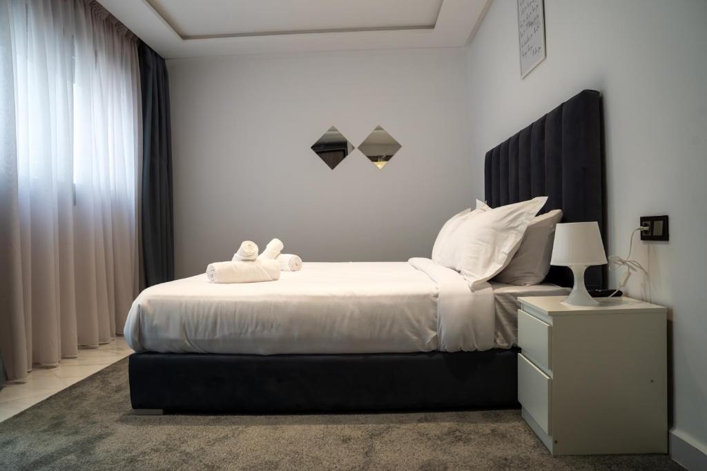 Postel nebo postele na pokoji v ubytování Amelia Appart-Hotel