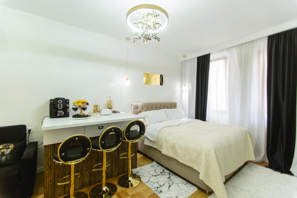 Postel nebo postele na pokoji v ubytování Golden Palace