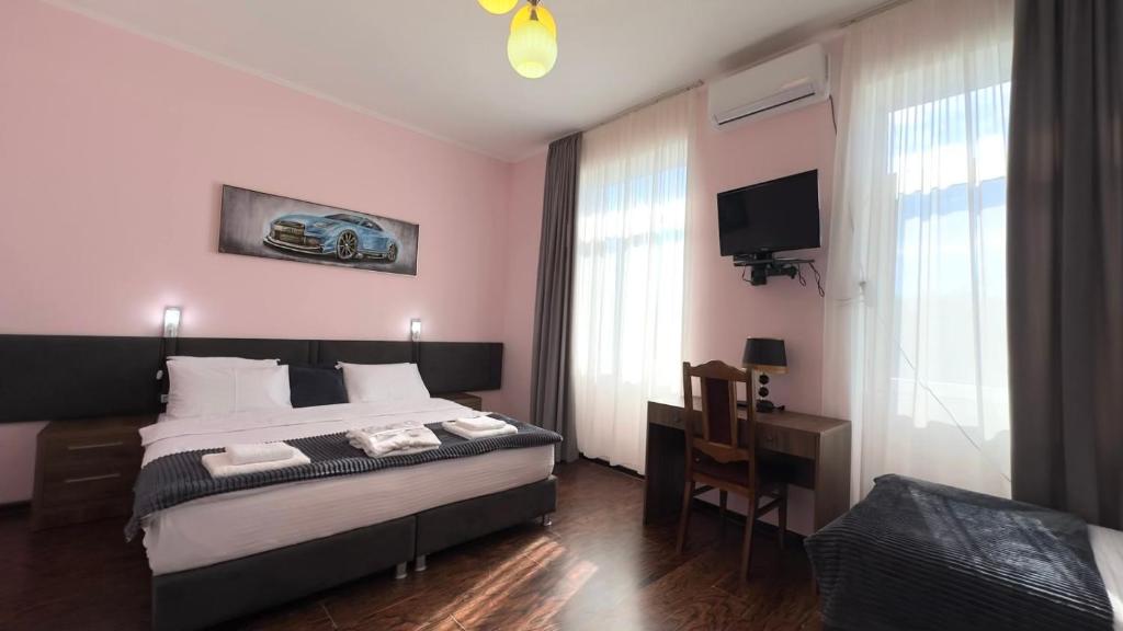 Postel nebo postele na pokoji v ubytování Europa Hotel-Kutaisi