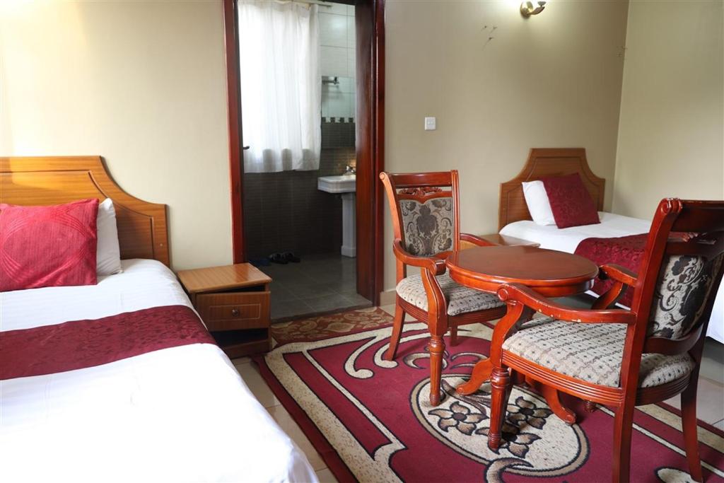 Postel nebo postele na pokoji v ubytování Hotel Intertropics