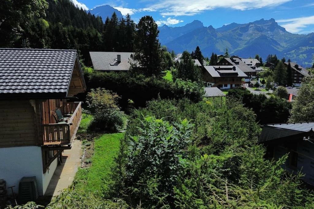 a view of a village with mountains in the background at Peace & comfort - Great views and location in Villars-sur-Ollon