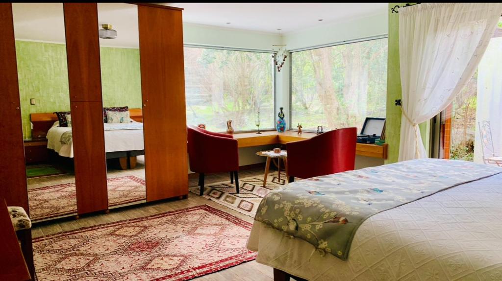 Postel nebo postele na pokoji v ubytování KURALEMU Casa de Campo