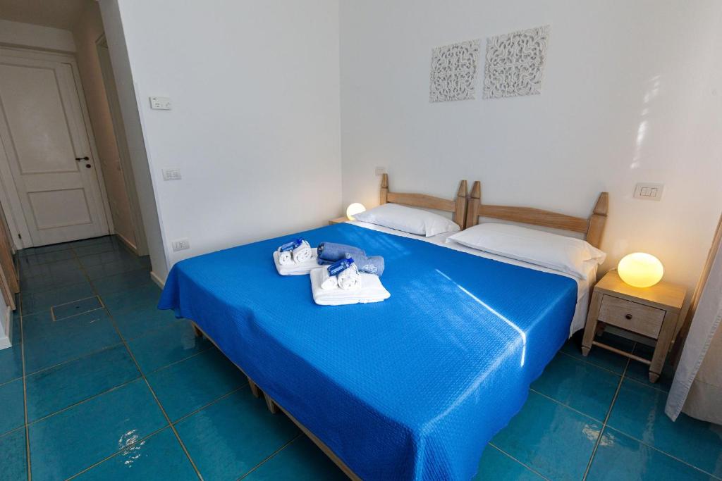 Postel nebo postele na pokoji v ubytování Villa Tre Mari