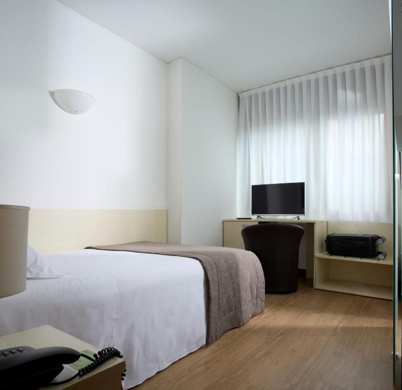 Postel nebo postele na pokoji v ubytování Hotel Eurorest