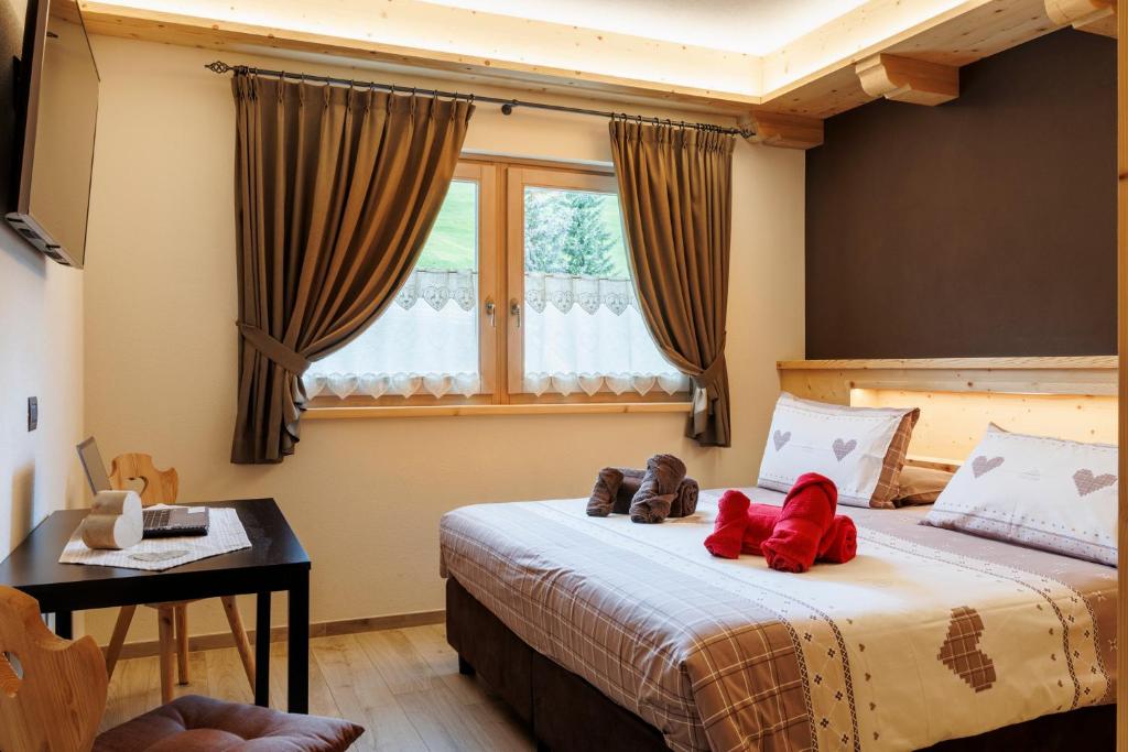 Łóżko lub łóżka w pokoju w obiekcie AG Apartments Livigno centro