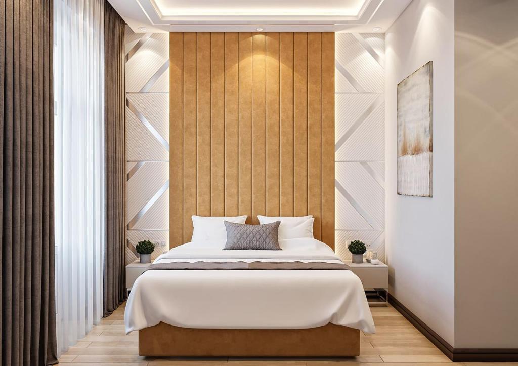 Postel nebo postele na pokoji v ubytování ZARA HoTEL