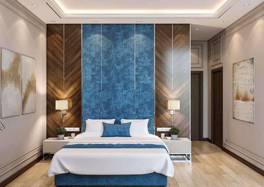 Postel nebo postele na pokoji v ubytování ZARA HoTEL