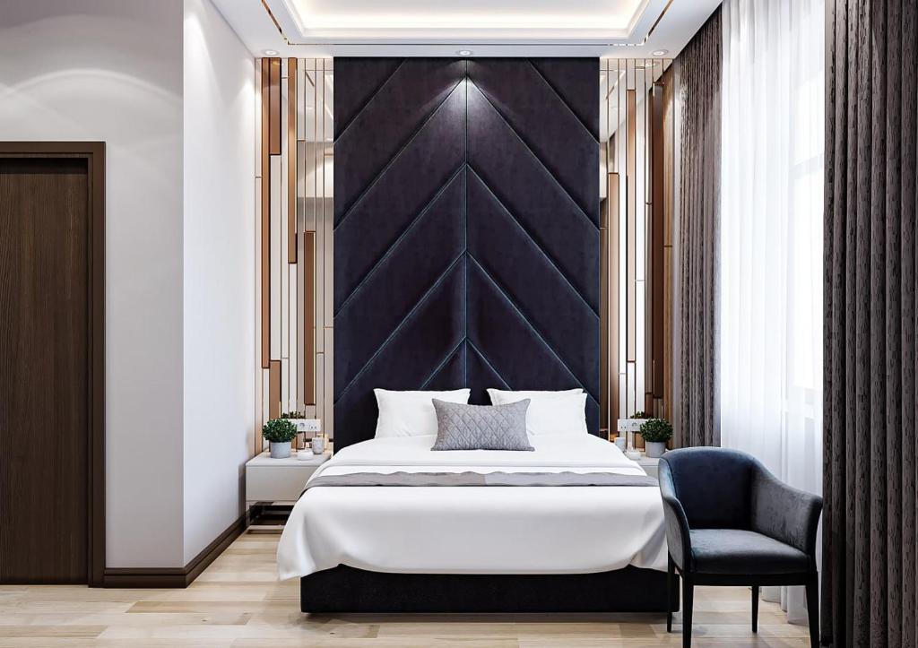 Postel nebo postele na pokoji v ubytování ZARA HoTEL