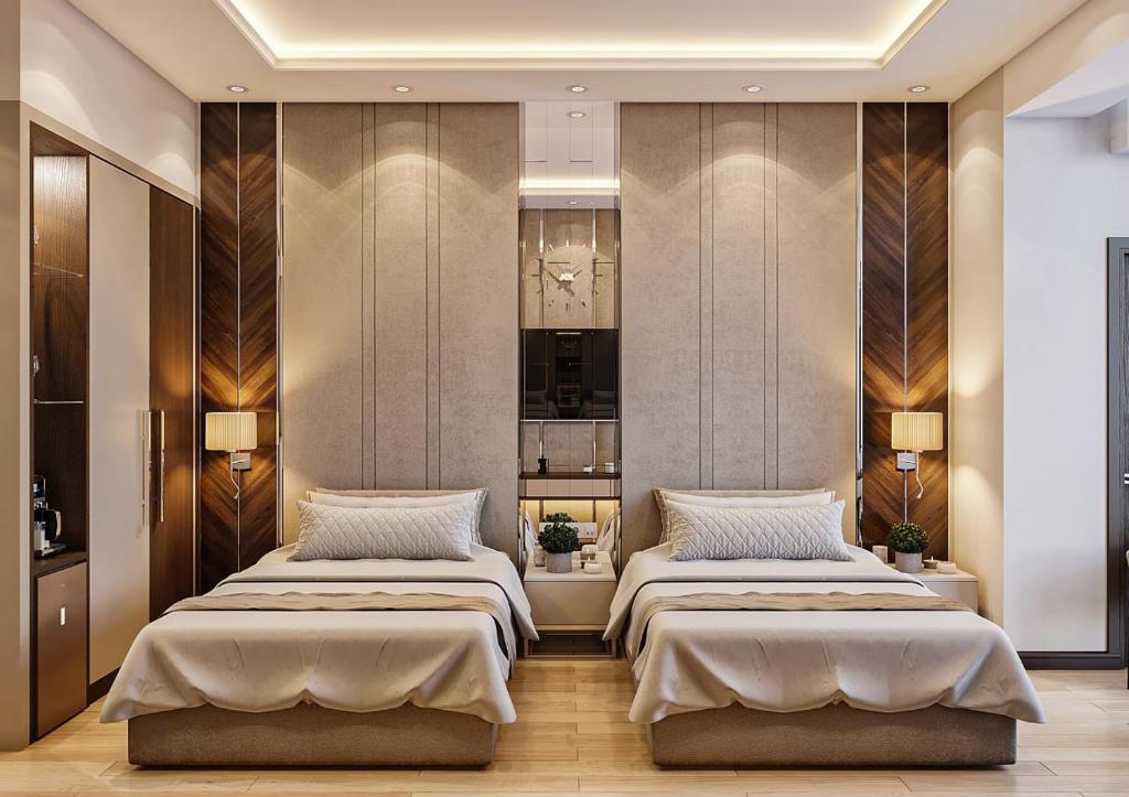 Postel nebo postele na pokoji v ubytování ZARA HoTEL