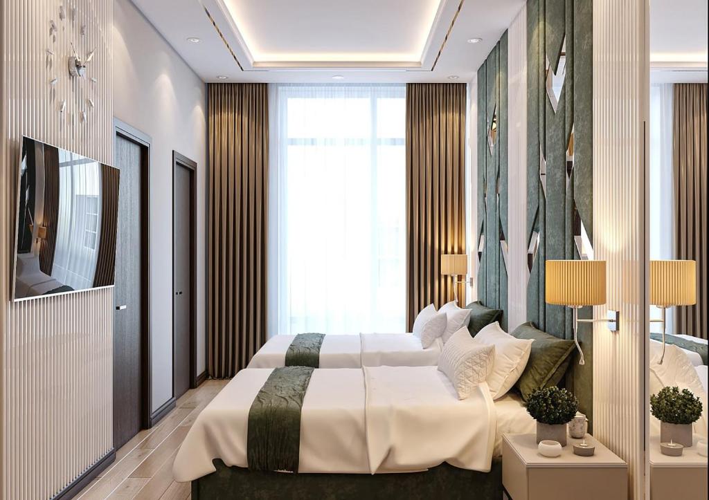 Postel nebo postele na pokoji v ubytování ZARA HoTEL
