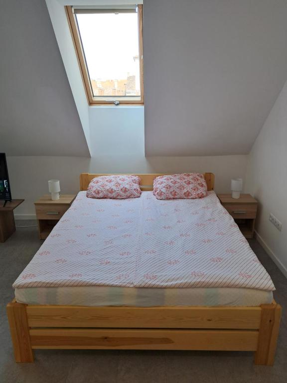 A bed or beds in a room at Atkacs Home