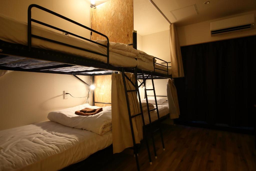 Postel nebo postele na pokoji v ubytování Hiroei Hostel
