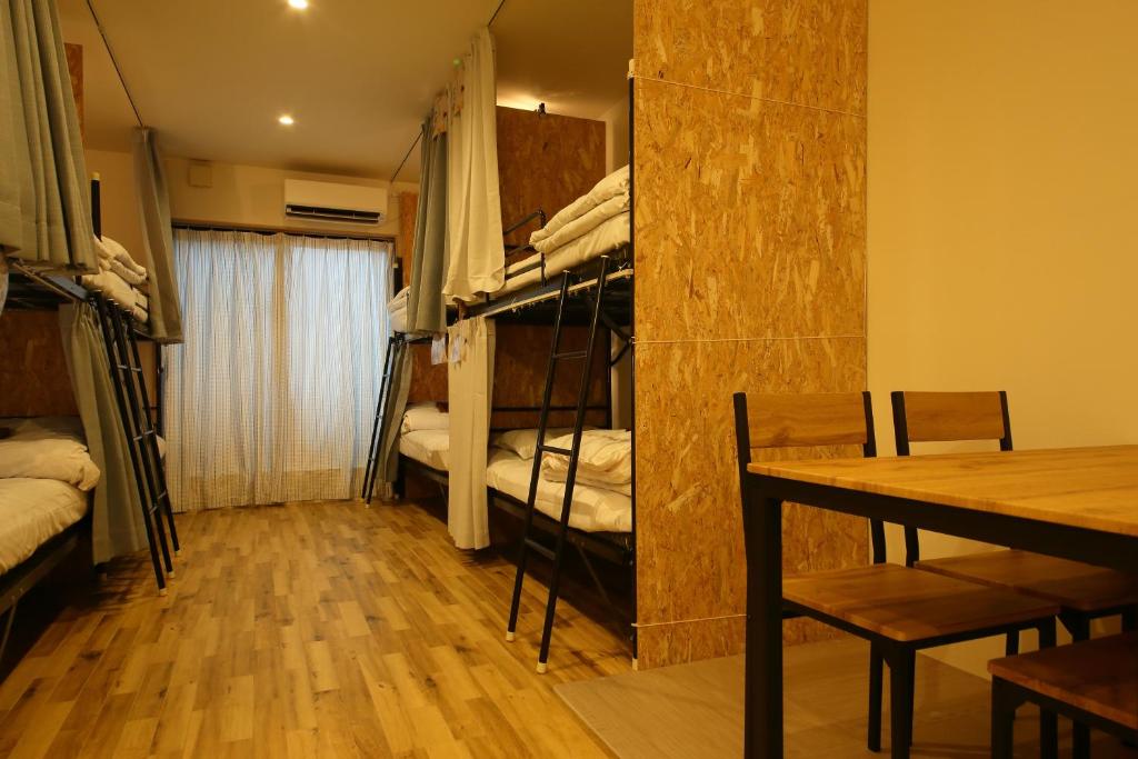 Postel nebo postele na pokoji v ubytování Hiroei Hostel