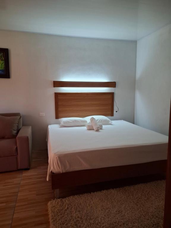 Postel nebo postele na pokoji v ubytování Bungalow Batsù