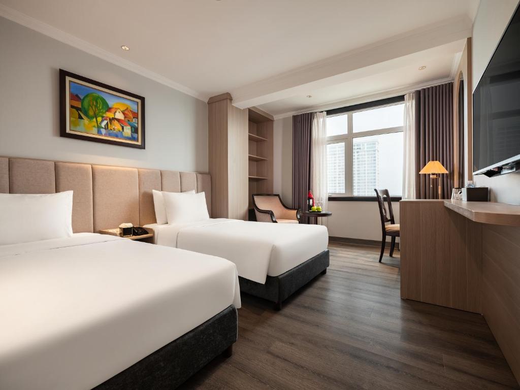 Postel nebo postele na pokoji v ubytování Minasi Premium Hotel