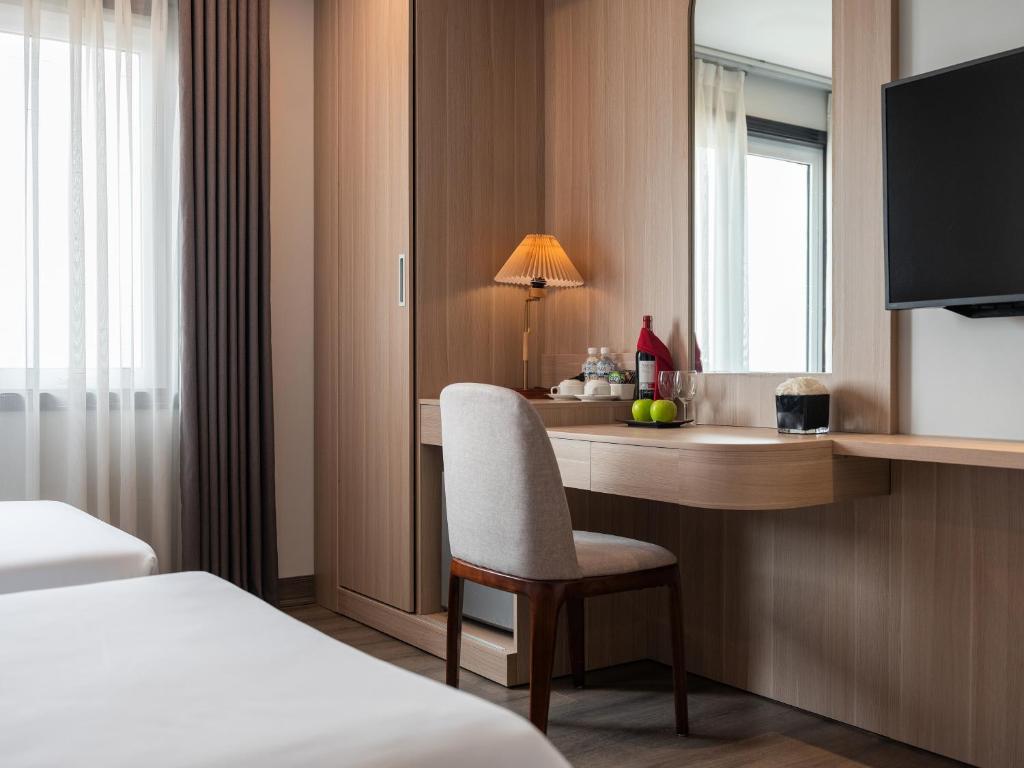Postel nebo postele na pokoji v ubytování Minasi Premium Hotel