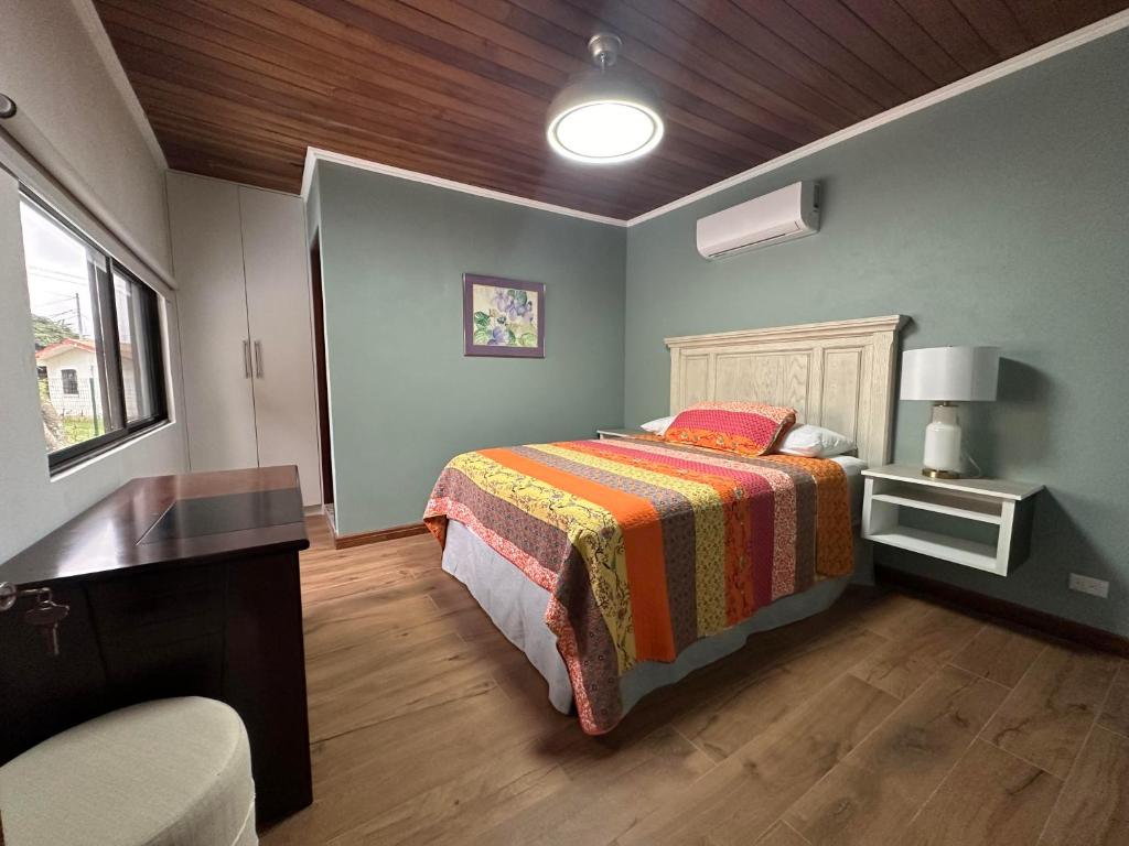 Postel nebo postele na pokoji v ubytování Casa Marigold
