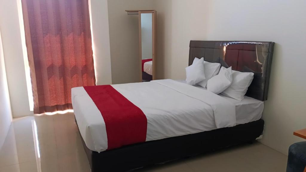 Postel nebo postele na pokoji v ubytování PLUM Dreamscape Bale Hinggil