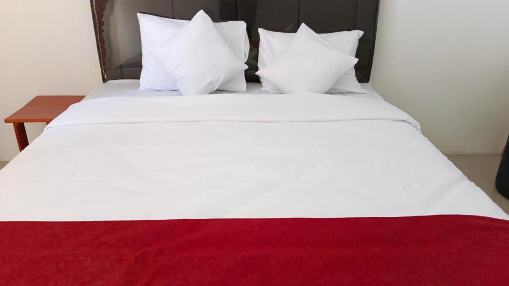 Postel nebo postele na pokoji v ubytování PLUM Dreamscape Bale Hinggil