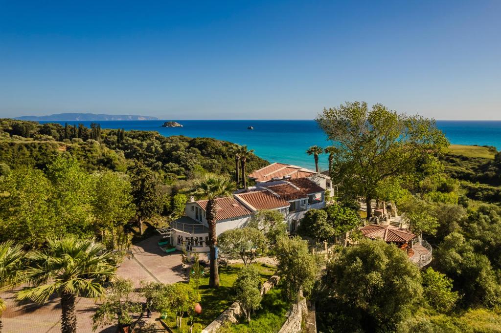 an aerial view of a house with the ocean in the background at Costa Avithos in Svoronata