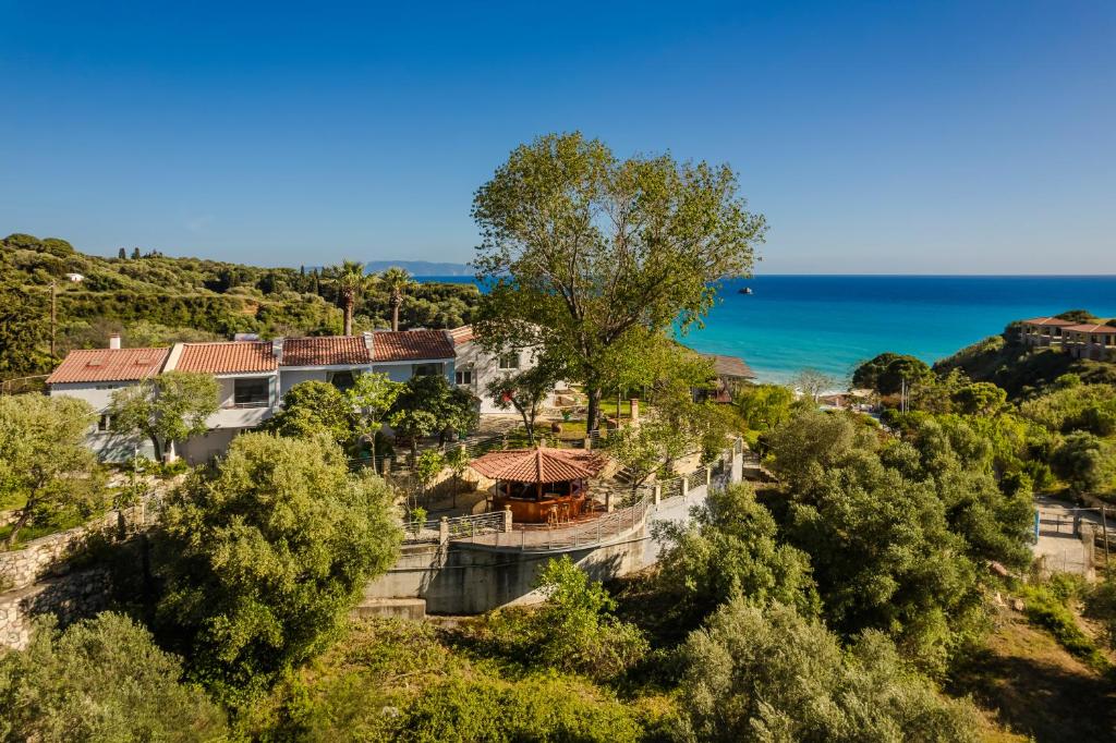 an aerial view of a house with the ocean in the background at Costa Avithos in Svoronata