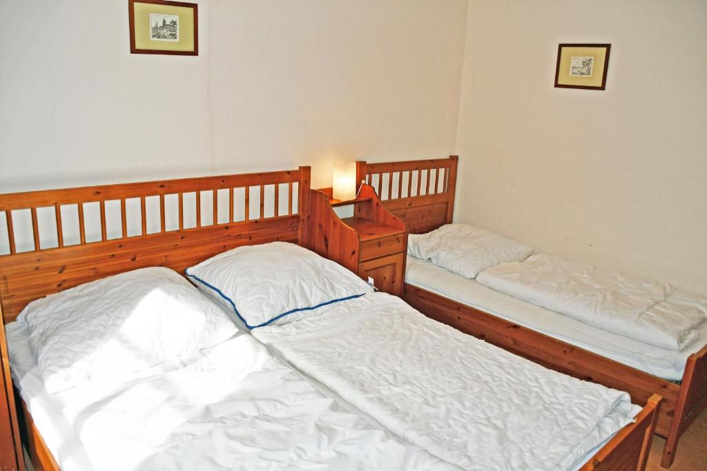 Postel nebo postele na pokoji v ubytování Haus am Hoeft in Gager mit Seeblick