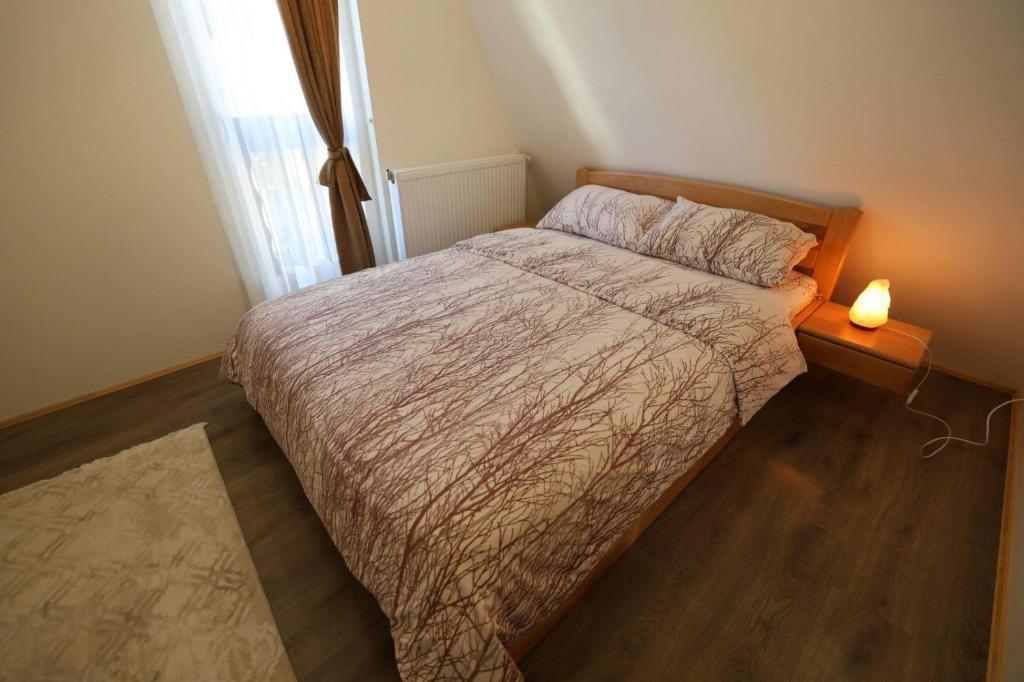 Postel nebo postele na pokoji v ubytování Zlatar Eyes