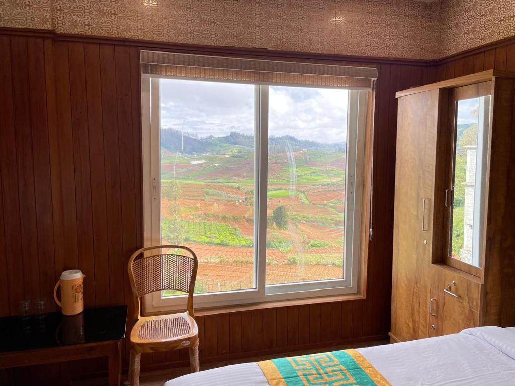 Postel nebo postele na pokoji v ubytování Meadow view ooty