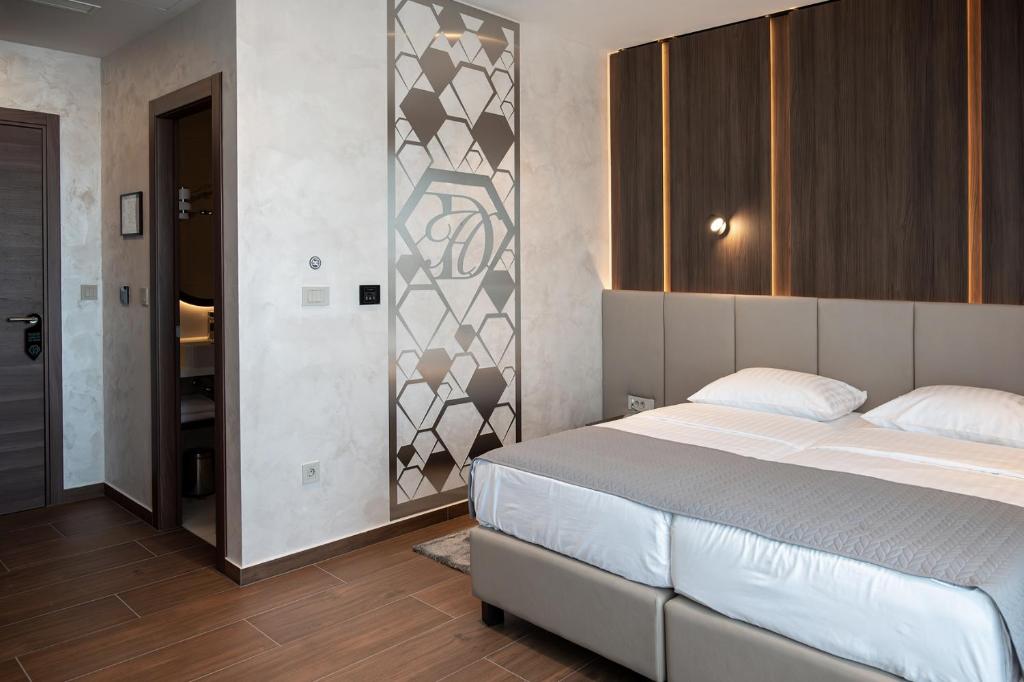 Postel nebo postele na pokoji v ubytování Diamond Hotel